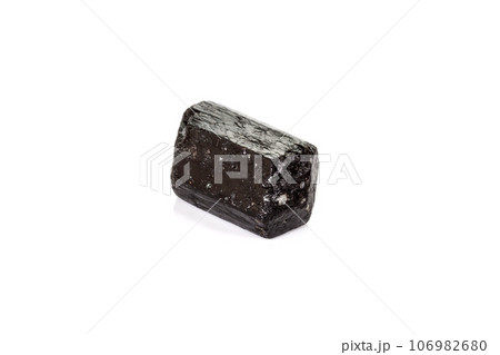 macro mineral stone schorl, black tourmaline on white background macro mineral stone schorl, black tourmaline on white background 106982680