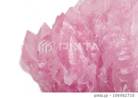 Macro mineral stone Rose quartz on white background 106982710