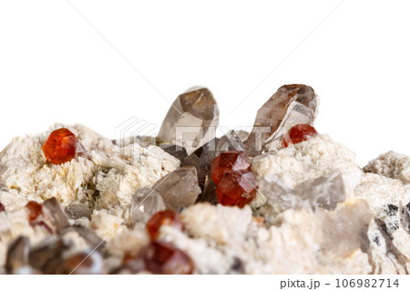 Macro mineral stone Spessartine, Feldspar, Smoky quartz, on a white background 106982714