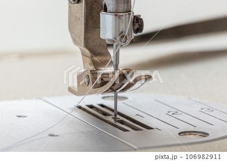Sewing machine needle with thread and fabric 106982911