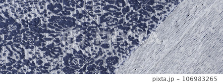 Blue and white textile with flower pattern. 106983265