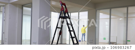 High ladder standing in center of empty office. High ladder standing in center of empty office. 106983267