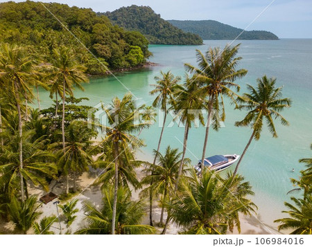 Tropical island of Koh Kood in Thailand. An exotic sunny beach with crystal clear waters. Tropical island of Koh Kood in Thailand. An exotic sunny beach with crystal clear waters. 106984016
