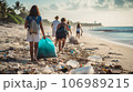 Group of volunteers collecting plastic waste on the beach. Recycling concept 106989215
