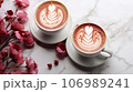 Two cups of cappuccino with latte art on marble background 106989241