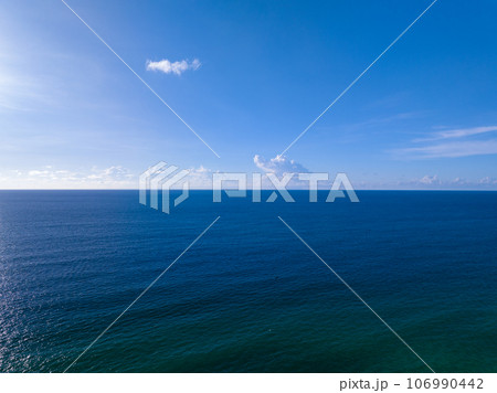 Waves sea water surface nature background,Sun rays over sea, Bird's eye view ocean in sunny day,Sea ocean waves water background Waves sea water surface nature background,Sun rays over sea, Bird's eye view ocean in sunny day,Sea ocean waves water background 106990442