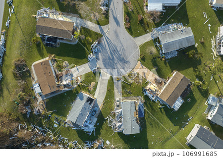 Property damage from strong hurricane winds. Mobile homes in Florida residential area with destroyed rooftops. Consequences of natural disaster 106991685
