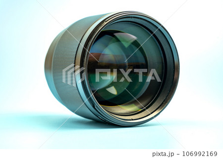 Optical digital camera lens isolated on blue background 106992169