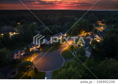 Low-density two story private homes at sunset. Rural street cul-de-sac dead end in residential suburbs with upscale suburban houses outside of Rochester, New York Low-density two story private homes at sunset. Rural street cul-de-sac dead end in residential suburbs with upscale suburban houses outside of Rochester, New York 106992206