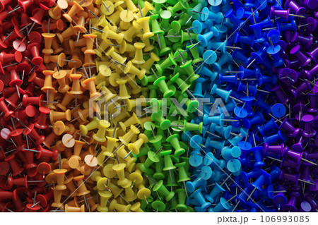 several assorted colors of plastic push pins 106993085