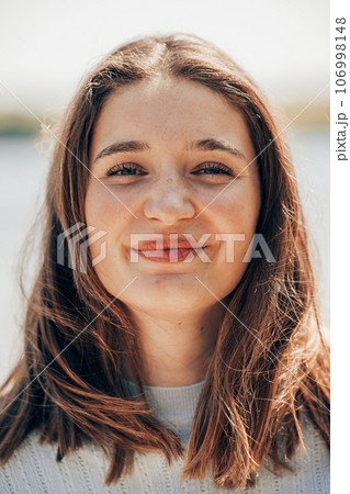 Captivating Millennial Beauty: Brown-Eyed Charmer in Natural Setting Captivating Millennial Beauty: Brown-Eyed Charmer in Natural Setting 106998148