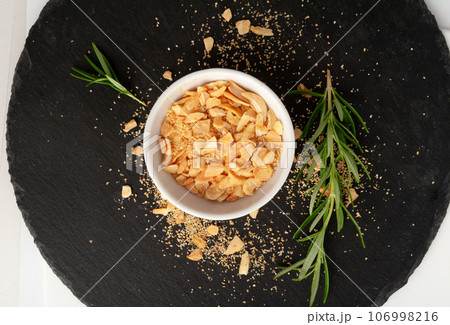 Dry Garlic Slices, Crispy Fried Cloves Pile Closeup, Roasted Grilled Garlic Flakes, Clove Chip Group Dry Garlic Slices, Crispy Fried Cloves Pile Closeup, Roasted Grilled Garlic Flakes, Clove Chip Group 106998216