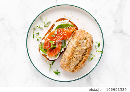 Salmon salted sandwich with spinach and cream cheese, top down view Salmon salted sandwich with spinach and cream cheese, top down view 106998526