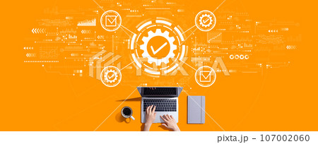 Quality control approval with person working with laptop Quality control approval with person working with laptop 107002060