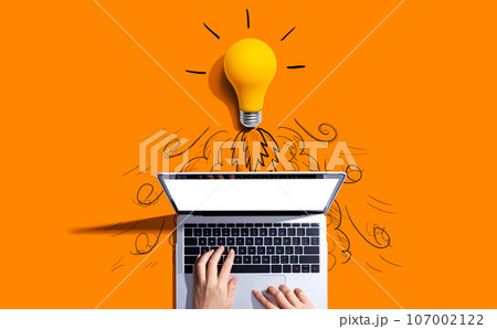 Idea light bulb flying to the sky like a rocket from a laptop computer 107002122