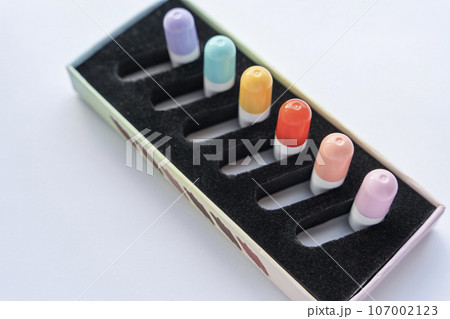 a set of tablets, vitamins in capsules lying in a special box 107002123