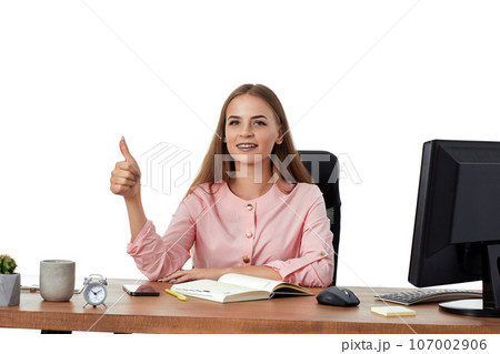 cheerful female manager showing Ok sign gesture 107002906