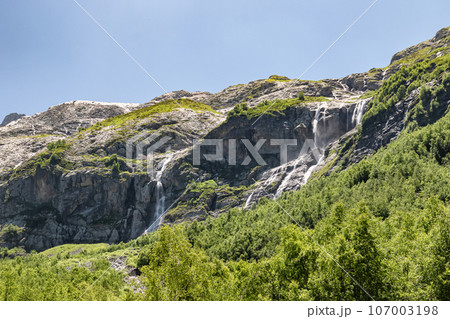 View of the valley of Sofia waterfalls with green mountain slopes, rocks and waterfalls View of the valley of Sofia waterfalls with green mountain slopes, rocks and waterfalls 107003198