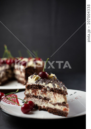 Home made cherry cake with vanilla and black cherries on wooden table 107004338