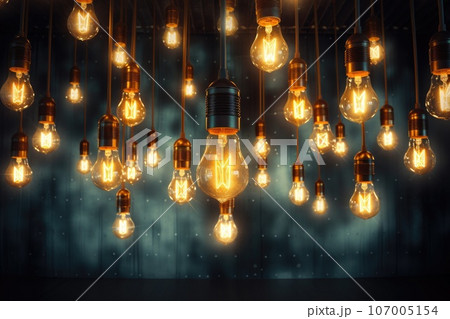 Many light bulbs hanging decor glowing on dark background. Many light bulbs hanging decor glowing on dark background. 107005154