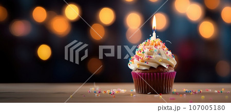 Delicious tasty cupcake with candle on dark background. Delicious tasty cupcake with candle on dark background. 107005180