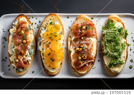 open sandwiches with pear prosciutto arugula and blue cheese. open sandwiches with pear prosciutto arugula and blue cheese. 107005319