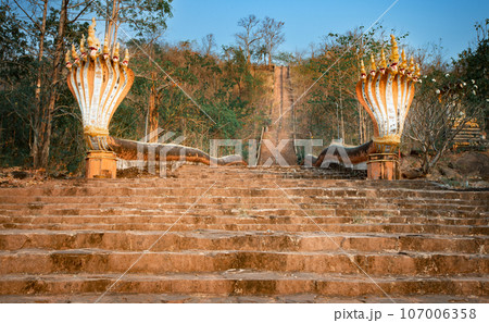 The railings of the stairs are. the Naga snake. Pakse, Laos The railings of the stairs are. the Naga snake. Pakse, Laos 107006358