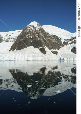Glaciers and mountains in Paradise bay, peninsula, Antartica.. Glaciers and mountains in Paradise bay, peninsula, Antartica.. 107006371