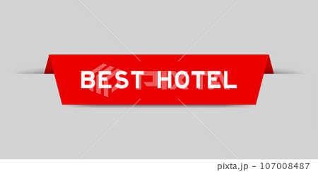 Red color inserted label with word best hotel on gray background 107008487