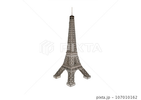 Eiffel Tower figurine made of simple material on white isolated background 107010162