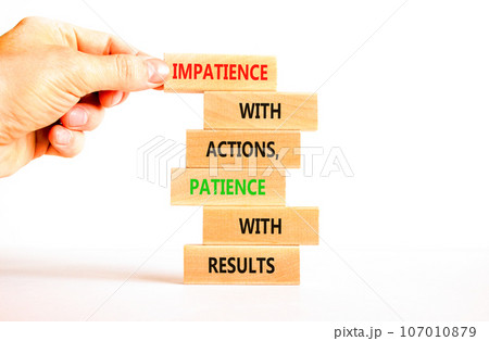 Action and result symbol. Concept words Impatience with actions patience with results on wooden block. Beautiful white table white background. Businessman hand. Business action result concept. Action and result symbol. Concept words Impatience with actions patience with results on wooden block. Beautiful white table white background. Businessman hand. Business action result concept. 107010879
