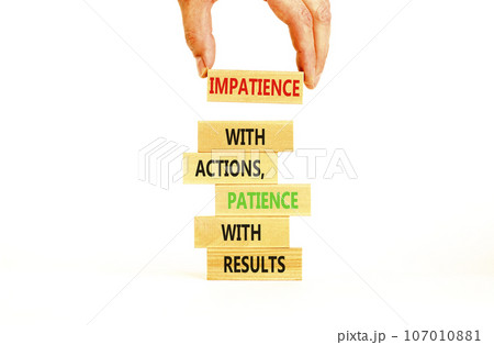 Action and result symbol. Concept words Impatience with actions patience with results on wooden block. Beautiful white table white background. Businessman hand. Business action result concept. 107010881