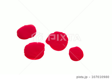 Shiny drops of red nail Polish isolated on white background 107010980