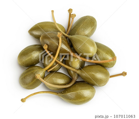 Capers isolated on white background. Pickled or canned capers. Top view. Flat lay Capers isolated on white background. Pickled or canned capers. Top view. Flat lay 107011063