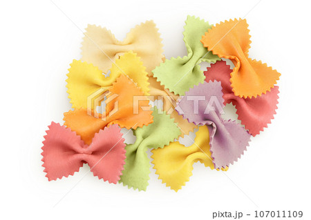 colorful farfalle pasta isolated on white background with full depth of field. Top view. Flat lay. colorful farfalle pasta isolated on white background with full depth of field. Top view. Flat lay. 107011109