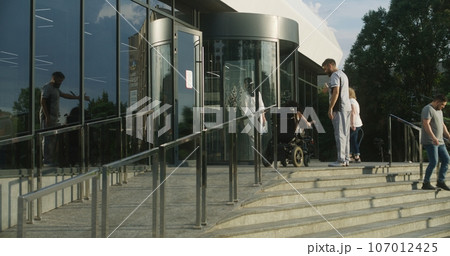 Male nurse meets female patient with disability Male nurse meets female patient with disability 107012425