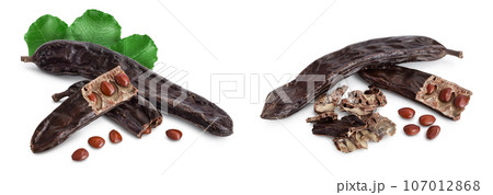 Ripe carob pods and bean isolated on white background with full depth of field Ripe carob pods and bean isolated on white background with full depth of field 107012868