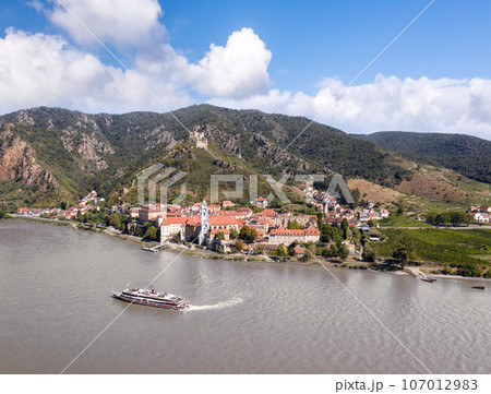 Panorama of Wachau valley (Unesco world heritage site) with ship on Danube river against Duernstein village in Lower Austria, Austria Panorama of Wachau valley (Unesco world heritage site) with ship on Danube river against Duernstein village in Lower Austria, Austria 107012983