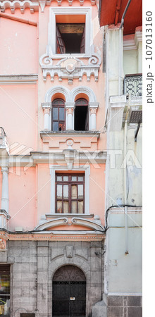 Street view of the facade of an old colonial building, Quito, Ecuador. Street view of the facade of an old colonial building, Quito, Ecuador. 107013160