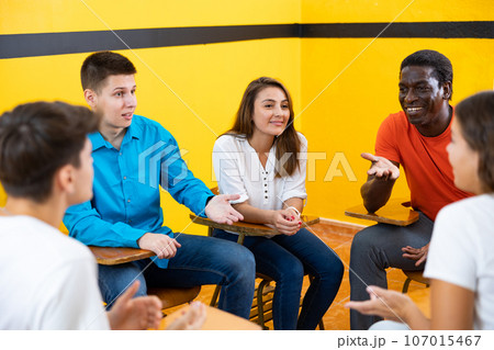 Group of multiracial people talking in speaking club 107015467