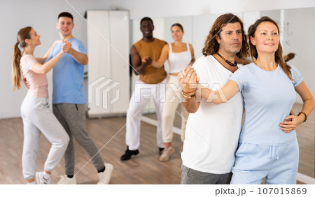 Adult man and adult woman dancing pair dance 107015869