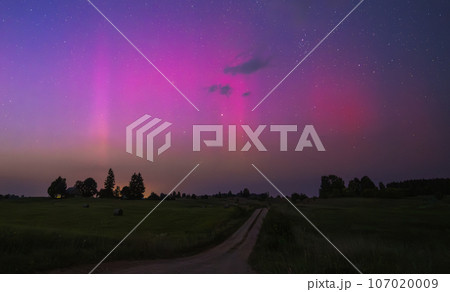 Northern lights - Aurora borealis dancing in the night sky. 107020009