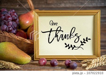 Fall Decoration with Fruits and Text Give Thanks 107022910