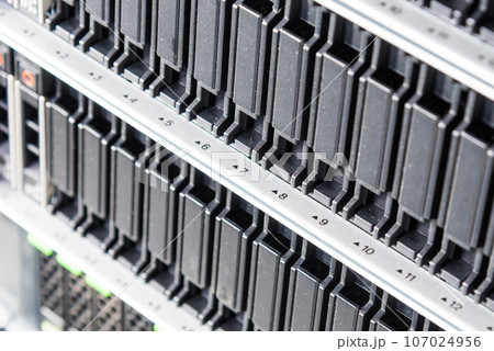 Row of hard disks used for data storage in internet data center Row of hard disks used for data storage in internet data center 107024956