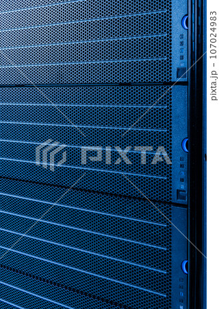 server rack with uncovered data storage arrays filled with hard drives - internet cloud provider concept 107024983