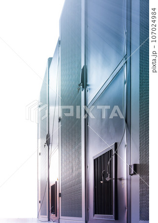 Data center with a row of server racks 107024984