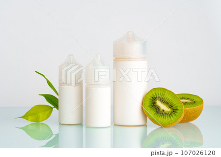 Vape liquid with kiwi flavor on white background 107026120