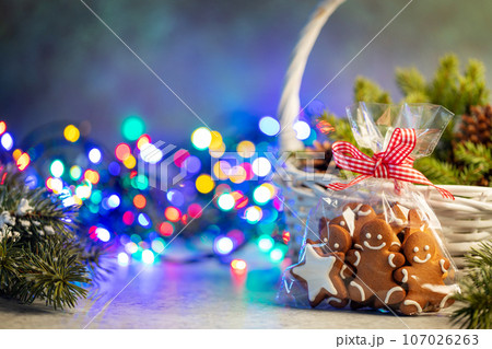Christmas gingerbread cookies and garland lights Christmas gingerbread cookies and garland lights 107026263