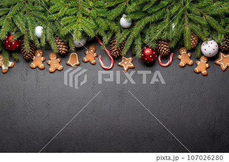 Christmas fir tree branch with decor and space Christmas fir tree branch with decor and space 107026280