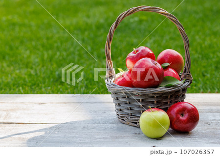 Basket with fresh red apples Basket with fresh red apples 107026357
